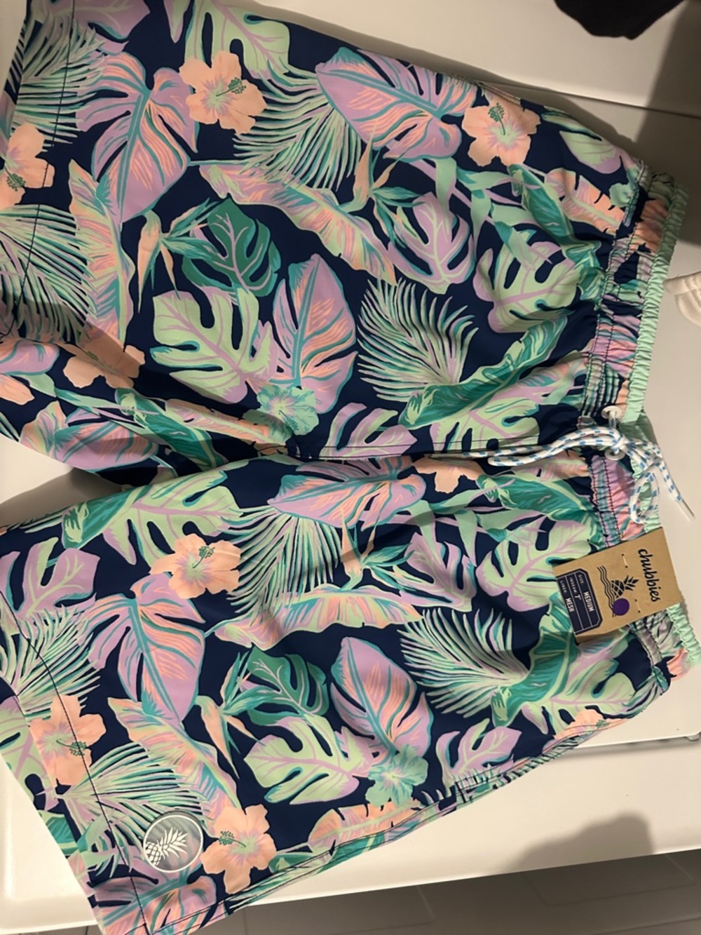 chubbies Navy Swim Trunks with Pastel Tropical Print
